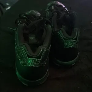 Adidas Black and Green Sneakers with Sporty Design