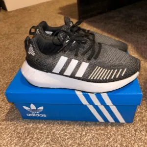 Adidas Black and White Sneakers with Athletic Style