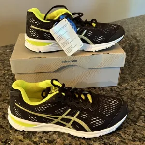 ASICS gel storm black lighting flash yellow kids sneakers NIB6.5