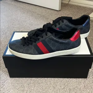Gucci Black and Red Sneakers with Sporty Design