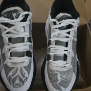 Kyrie 8Nike Black and White Sporty Sneakers with Cushioned Sole