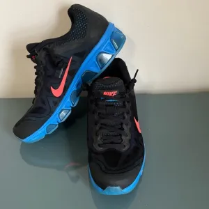 Nike Men's Air Max Tailwind 7 Running Sneakers.  Black, blue and pinkish/red. 6
