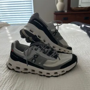 On Running White and Black Sneakers