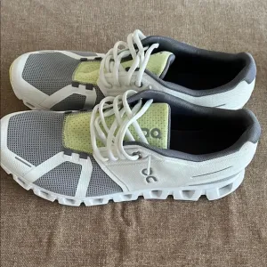 On Running White and Gray Sneakers