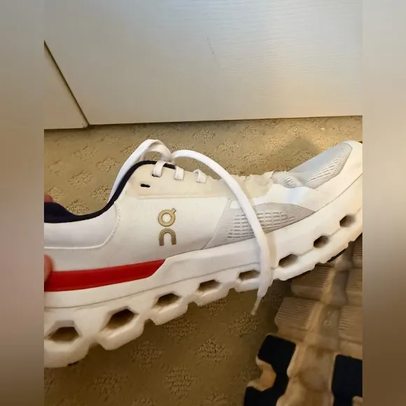 On Running White and Red Sneakers