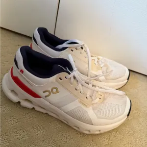 On Running White and Red Sneakers