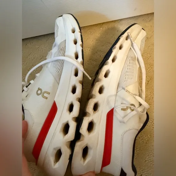 On Running White and Red Sneakers