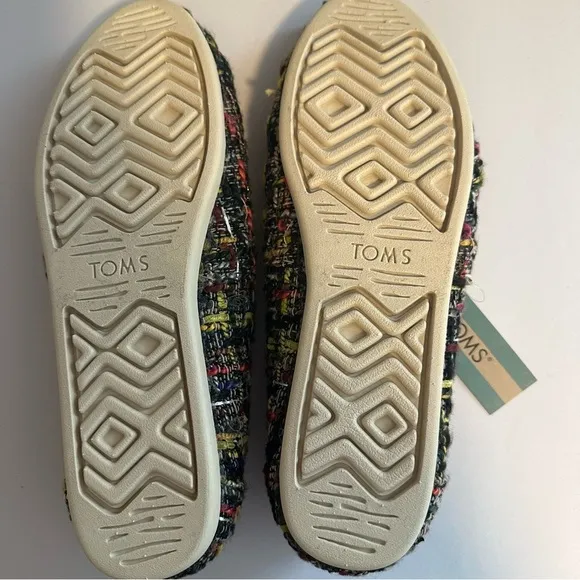 Tom’s woman’s alpargara slip on Sherpa lined shoes.