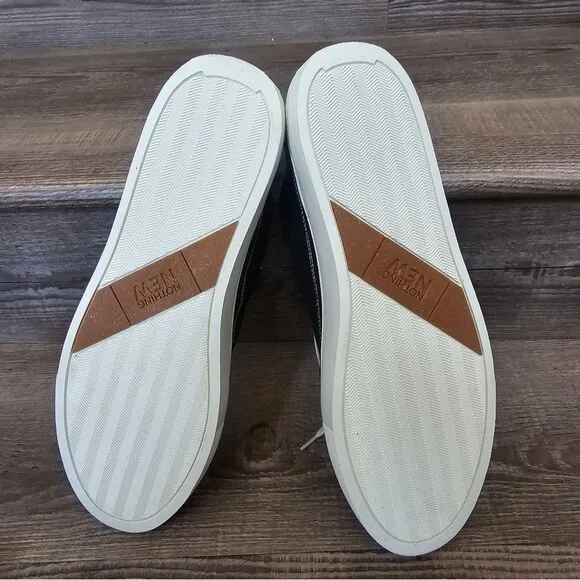 We are nothing new black and white casual tennis shoes Men's size 12.5
