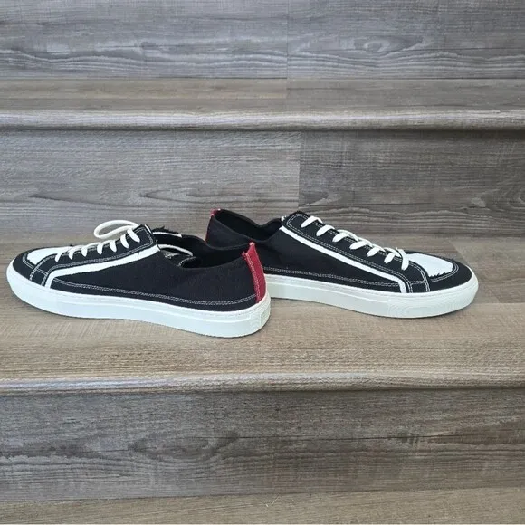 We are nothing new black and white casual tennis shoes Men's size 12.5