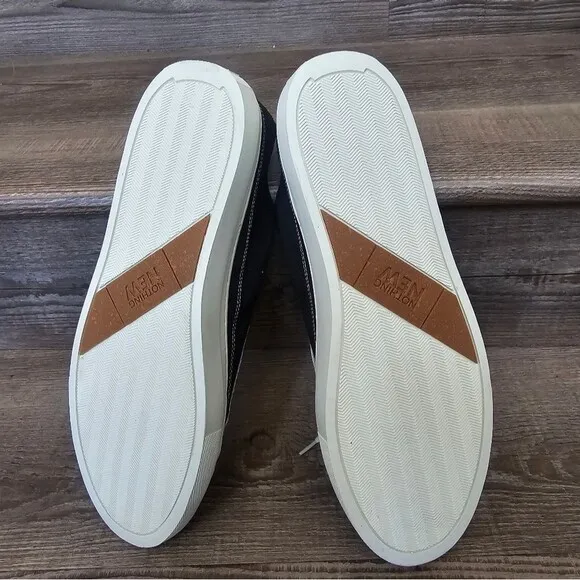 We are nothing new black and white casual tennis shoes Men's size 12.5