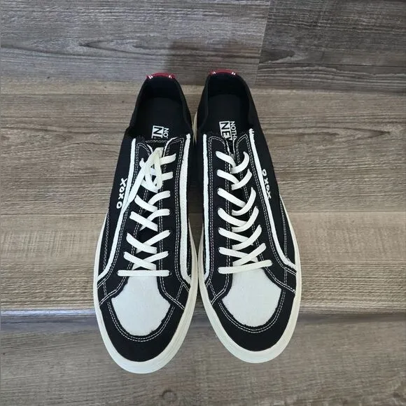 We are nothing new black and white casual tennis shoes Men's size 12.5